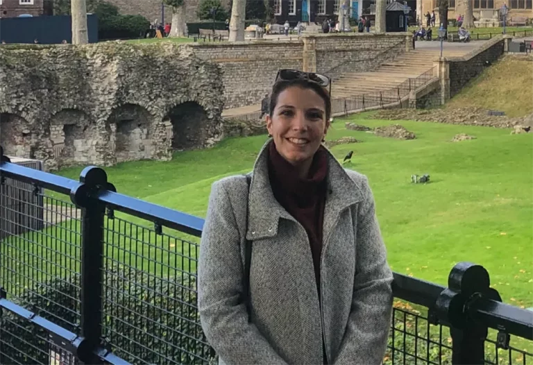 Molly Silvia standing in front of The Tower of London