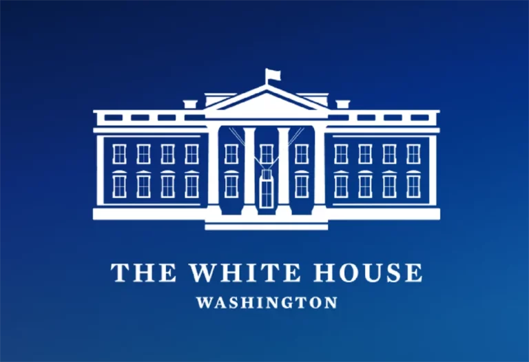 The White House logo knocked-out on a blue background