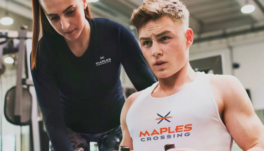 man and women working out at Maples Crossing