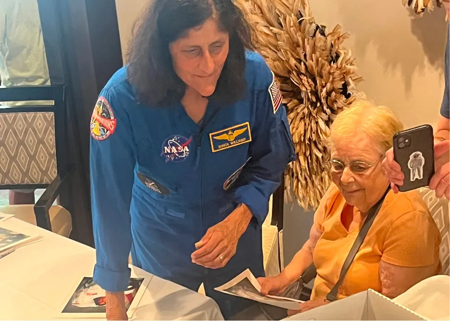 Suni Willams looking a documents