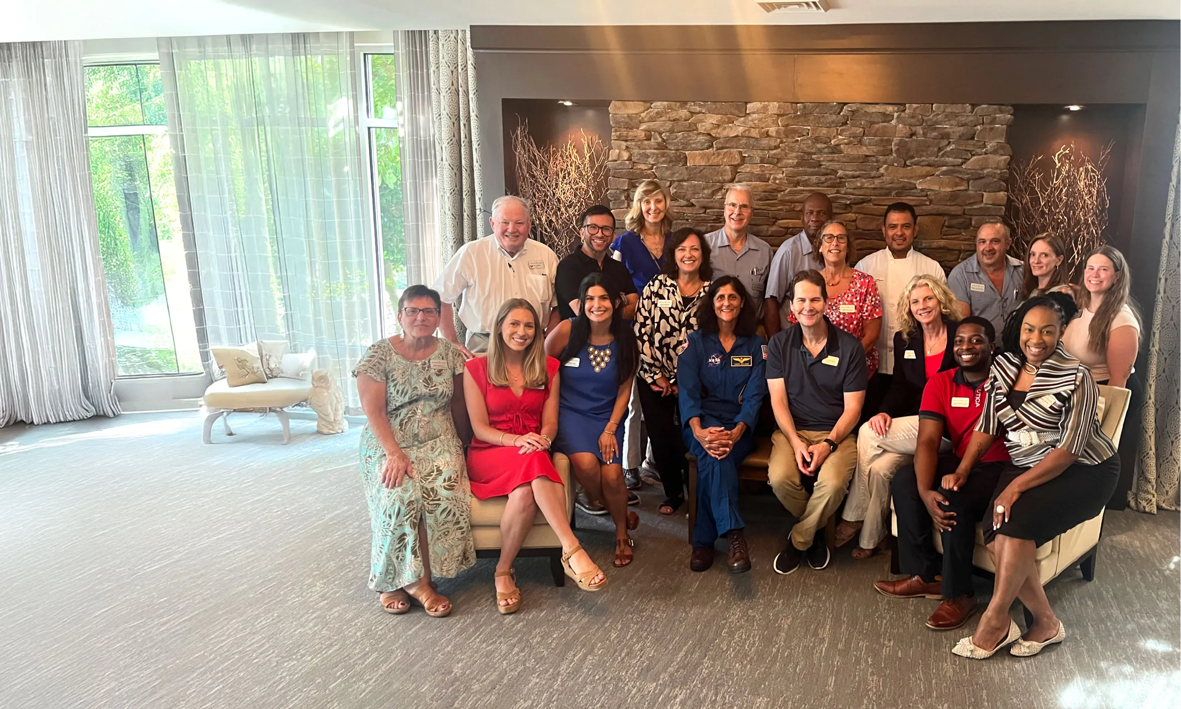 Wingate team sitting for a formal photo with Suni Williams