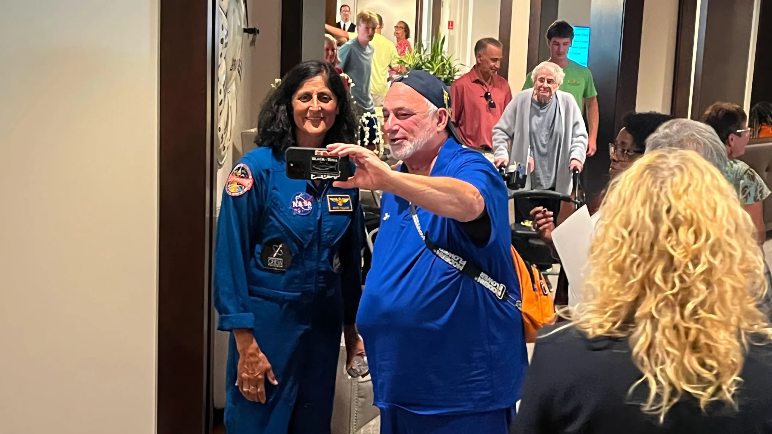 Suni Williams taking a selfie with a male fan at Winegate