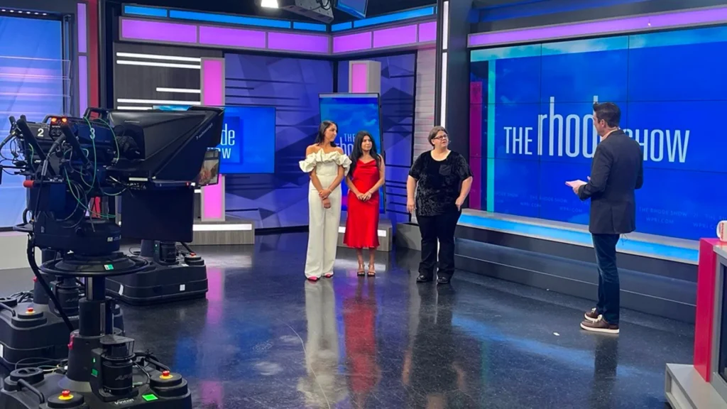 Behind the scenes of a live television segment featuring Wingate Residences on Blackstone Boulevard and their fashion show.